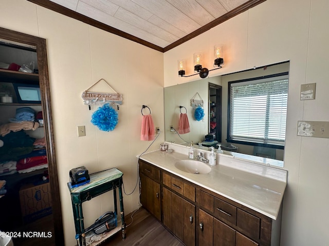 bathroom with vanity, wood-type flooring, crown molding, and wood ceiling