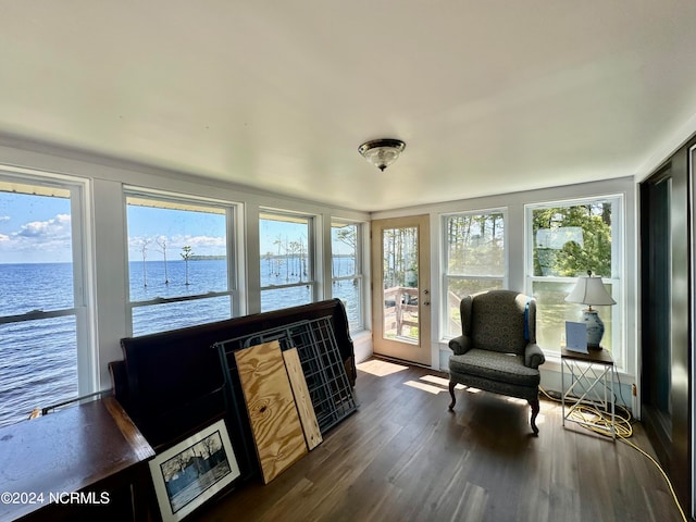 sunroom / solarium with a water view