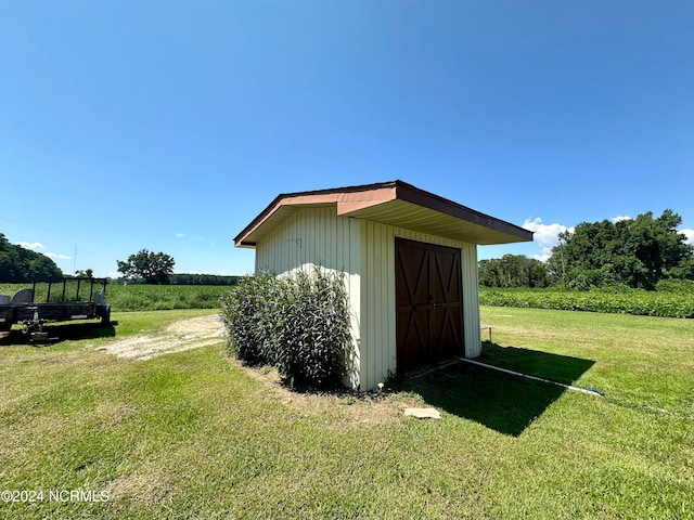 view of outdoor structure with a lawn