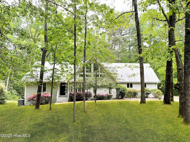 single story home with central AC and a front lawn