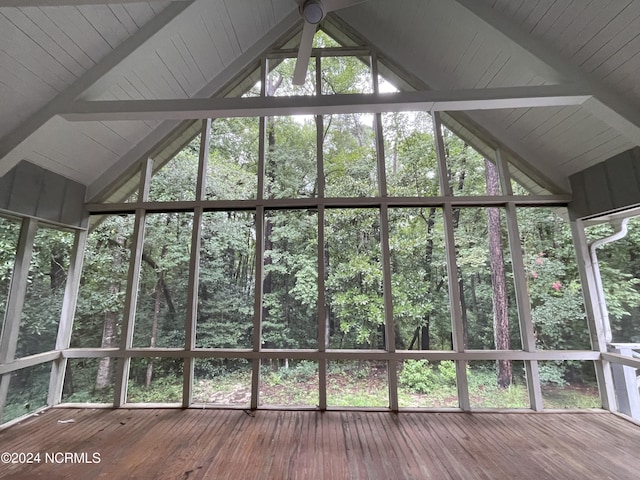 unfurnished sunroom with a view of trees