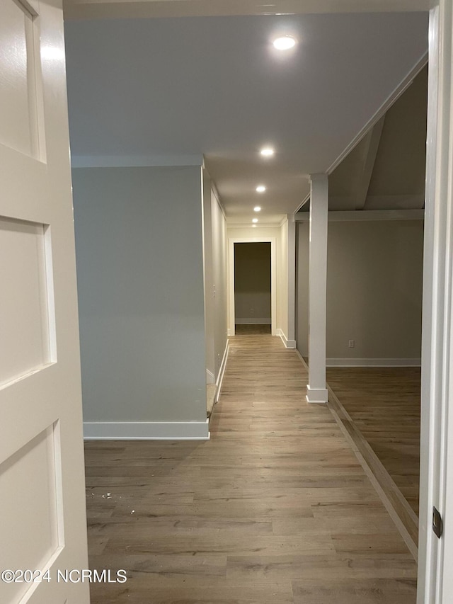 hall with recessed lighting, baseboards, and wood finished floors