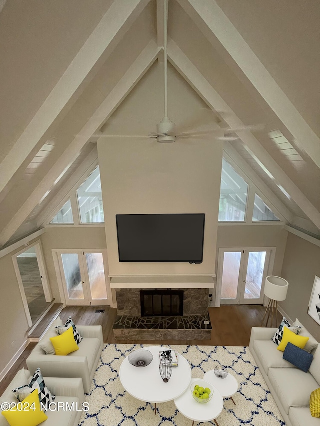 living room with high vaulted ceiling, french doors, beam ceiling, and wood finished floors