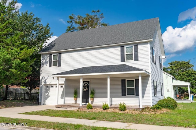 front of property featuring a porch and a garage