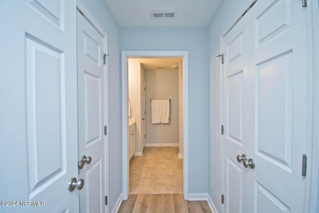 hall featuring light hardwood / wood-style flooring