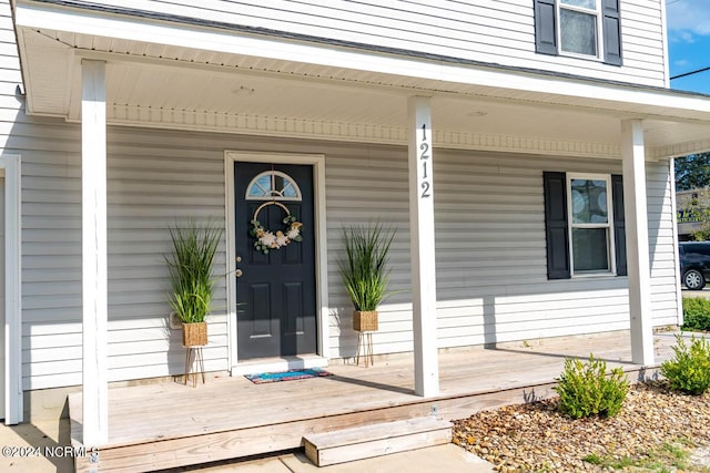 doorway to property with covered porch