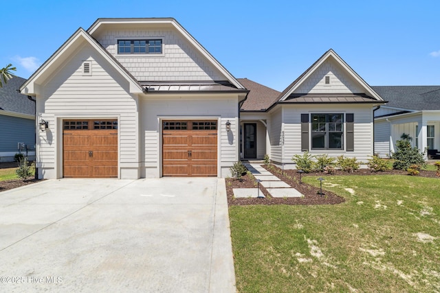 5037 Saltgrass Cv, Leland, NC 28451 - view of front facade featuring a standing seam roof, driveway, a front lawn, metal roof, and an attached garage