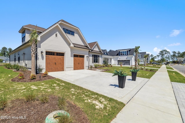 5037 Saltgrass Cv, Leland, NC 28451 - view of front of house featuring concrete driveway, a front lawn, and a garage