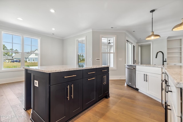 5037 Saltgrass Cv, Leland, NC 28451 - kitchen with a kitchen island, crown molding, white cabinetry, stainless steel dishwasher, and dark cabinetry