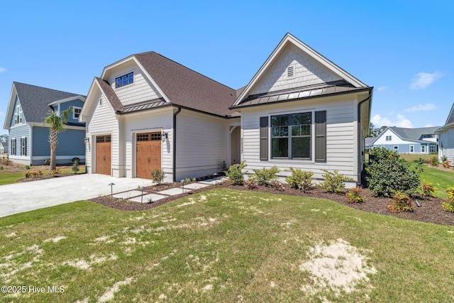 5037 Saltgrass Cv, Leland, NC 28451 - view of front of house with a standing seam roof, a front yard, metal roof, concrete driveway, and roof with shingles