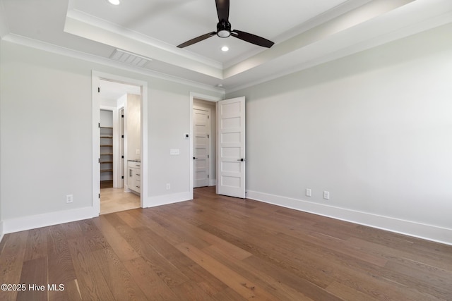 5037 Saltgrass Cv, Leland, NC 28451 - unfurnished bedroom with a tray ceiling, wood finished floors, crown molding, recessed lighting, and baseboards