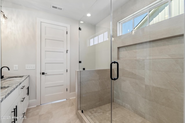 5037 Saltgrass Cv, Leland, NC 28451 - full bath featuring a stall shower, vanity, recessed lighting, tile patterned flooring, and baseboards