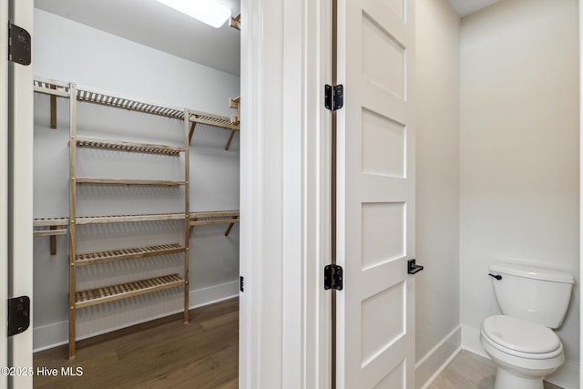 5037 Saltgrass Cv, Leland, NC 28451 - spacious closet with wood finished floors