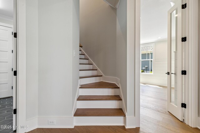 5037 Saltgrass Cv, Leland, NC 28451 - stairway with wood finished floors and baseboards