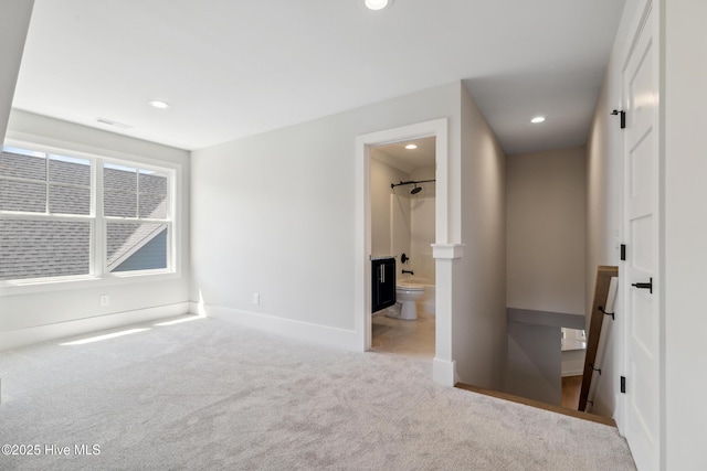 5037 Saltgrass Cv, Leland, NC 28451 - unfurnished bedroom featuring carpet flooring, baseboards, recessed lighting, and ensuite bathroom