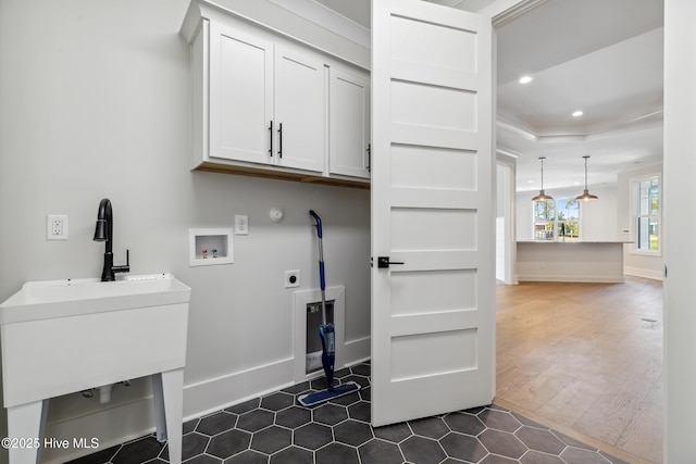 5037 Saltgrass Cv, Leland, NC 28451 - washroom featuring cabinet space, washer hookup, electric dryer hookup, recessed lighting, and baseboards