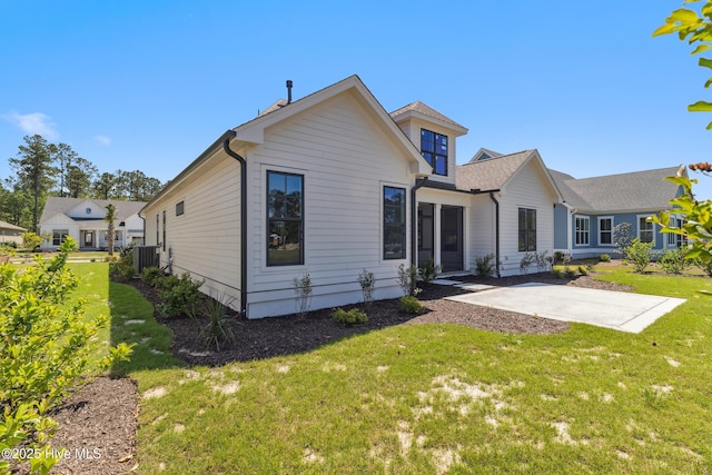 5037 Saltgrass Cv, Leland, NC 28451 - view of front of property featuring a patio area, central AC, and a front lawn