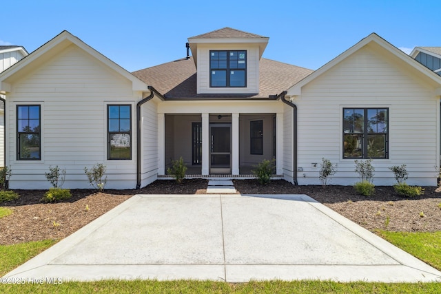 5037 Saltgrass Cv, Leland, NC 28451 - modern farmhouse style home with a shingled roof