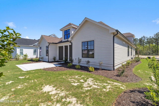 5037 Saltgrass Cv, Leland, NC 28451 - rear view of property with a patio area and a yard
