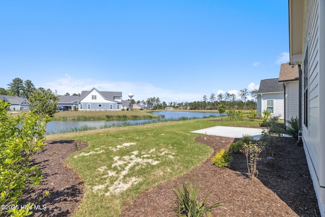 5037 Saltgrass Cv, Leland, NC 28451 - view of grassy yard featuring a patio area and a water view