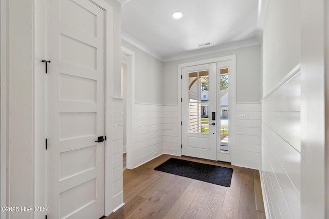 5037 Saltgrass Cv, Leland, NC 28451 - entryway featuring ornamental molding, wainscoting, dark wood finished floors, and recessed lighting