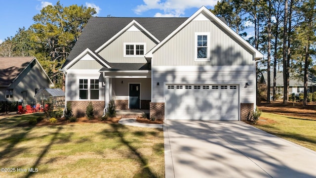 view of front of house featuring a front yard and a garage