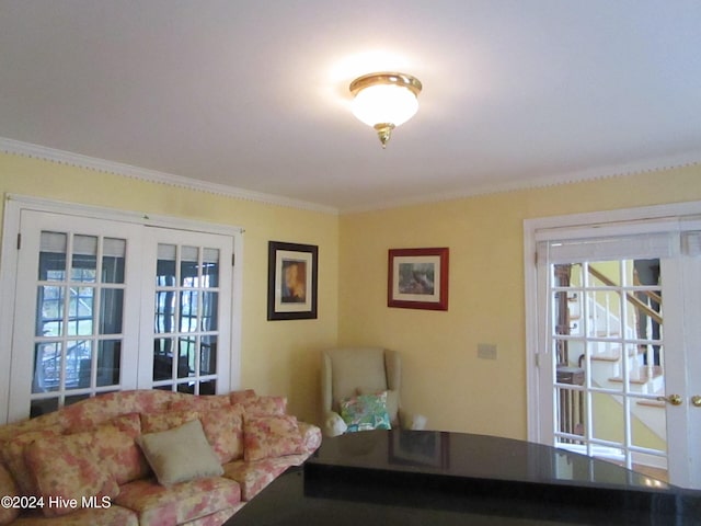 living area with ornamental molding