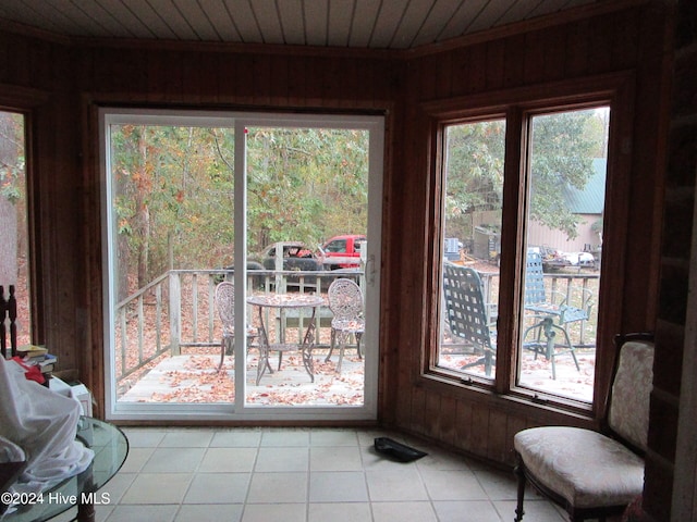 sunroom / solarium featuring wood ceiling