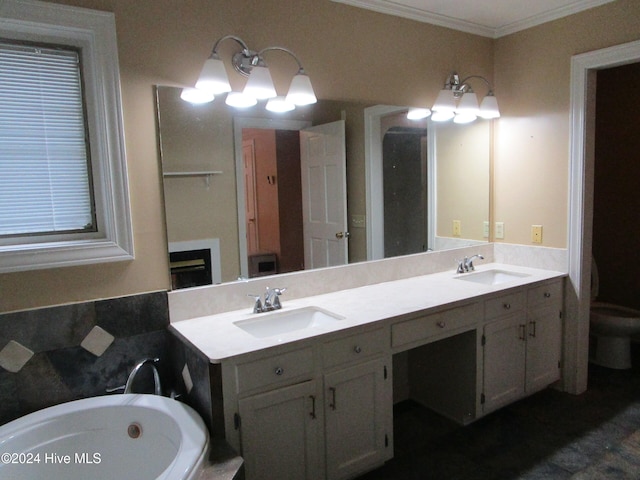 bathroom with double vanity, a bathtub, a sink, and ornamental molding