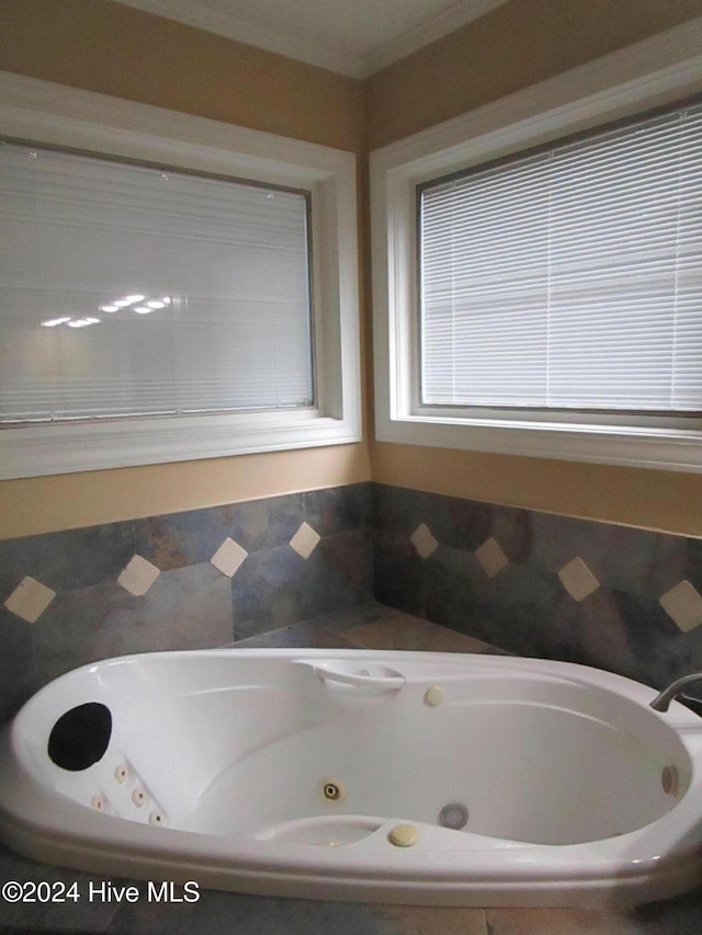 full bathroom featuring a whirlpool tub