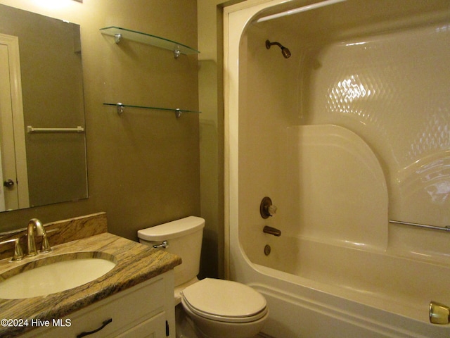 full bath featuring shower / bathtub combination, vanity, and toilet