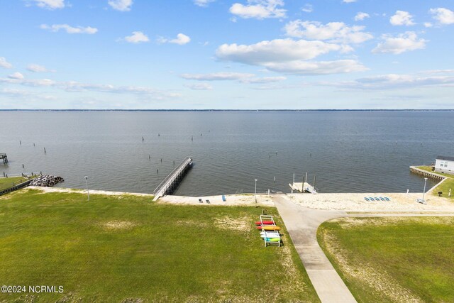 exterior space with a lawn and a water view