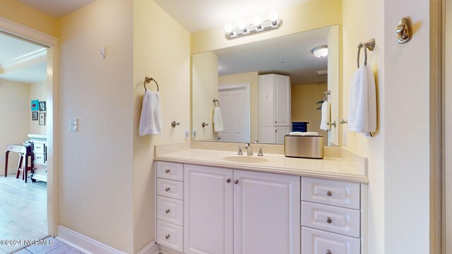 bathroom with hardwood / wood-style floors and vanity