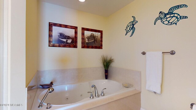 bathroom with tiled tub