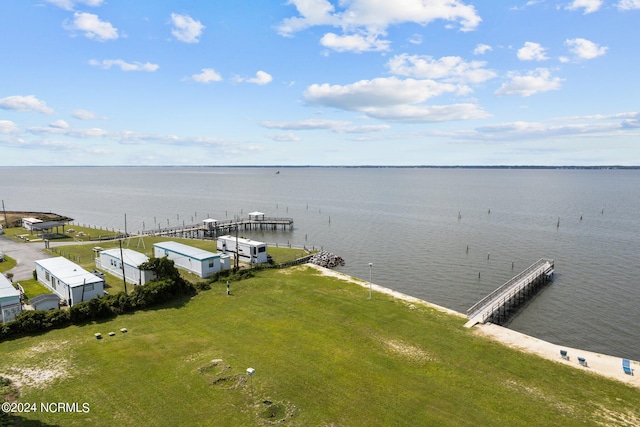 exterior space with a lawn and a water view