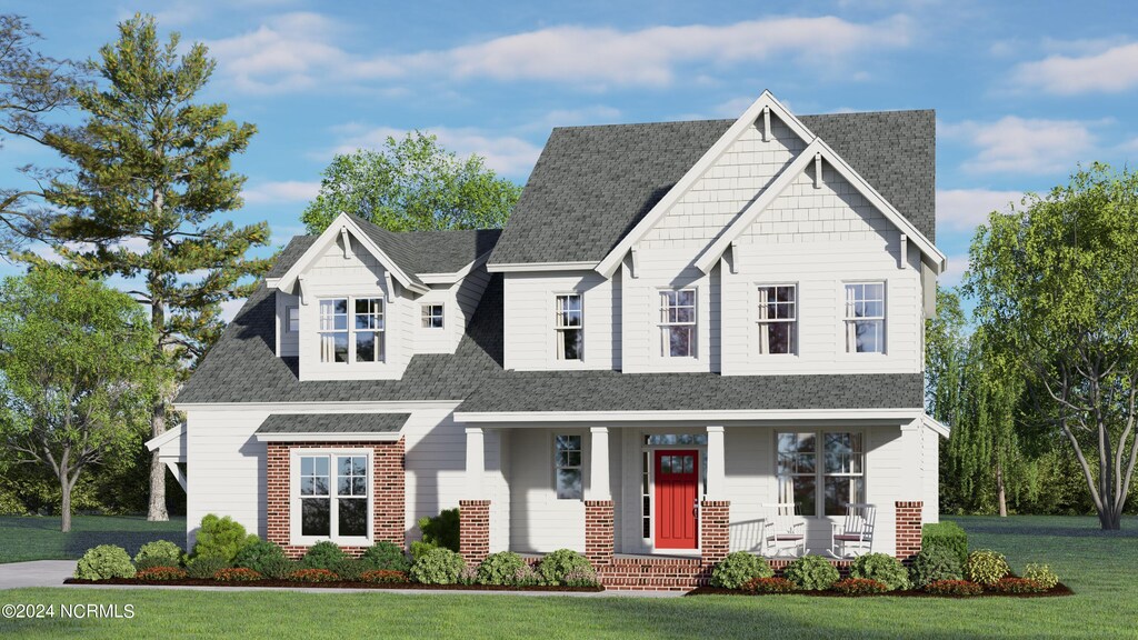 view of front of house featuring a front lawn and a porch