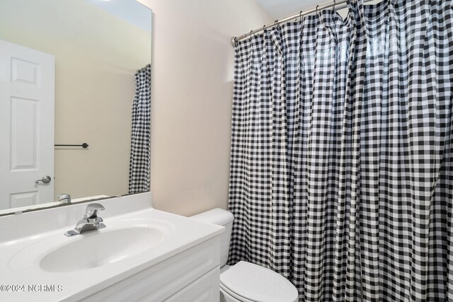 full bath with vanity and toilet