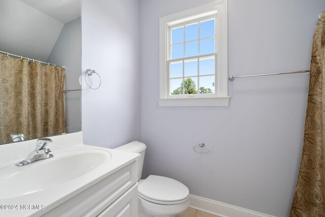 bathroom with toilet, baseboards, and vanity