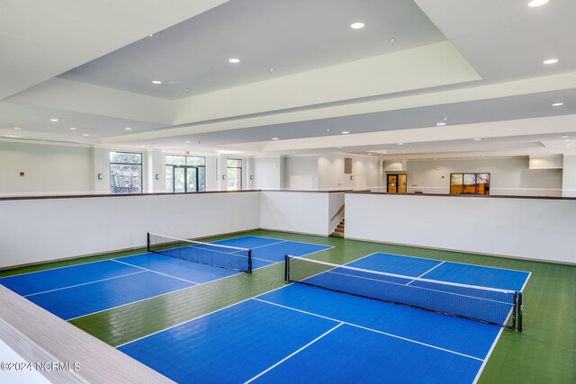 view of tennis court featuring community basketball court