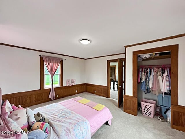 bedroom featuring wooden walls, crown molding, and light colored carpet