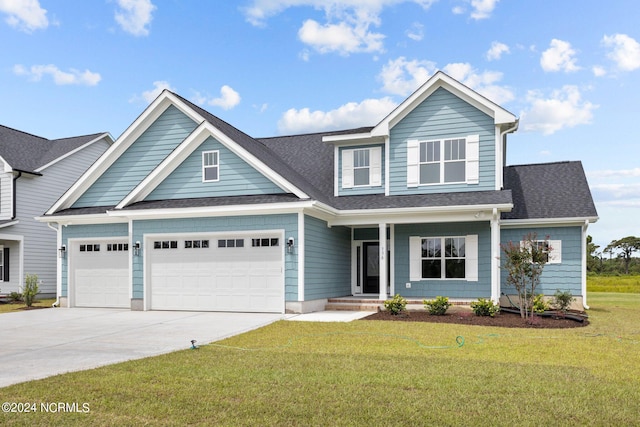 craftsman inspired home featuring a porch and a front lawn