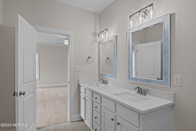 bathroom featuring tile patterned floors, vanity, and ceiling fan