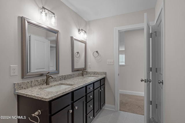 bathroom with tile patterned floors and vanity