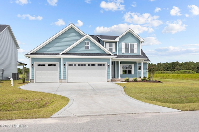 view of front facade with a garage, a front yard, concrete driveway, and cooling unit