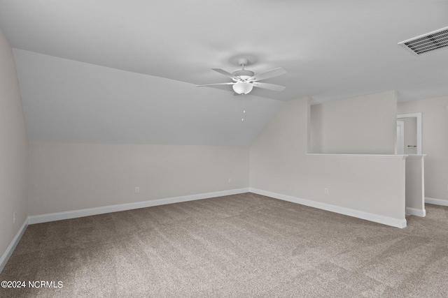 bonus room with carpet floors, ceiling fan, and vaulted ceiling