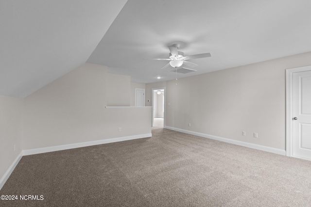 additional living space with ceiling fan, vaulted ceiling, and carpet floors