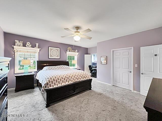 bedroom with carpet, ceiling fan, and baseboards