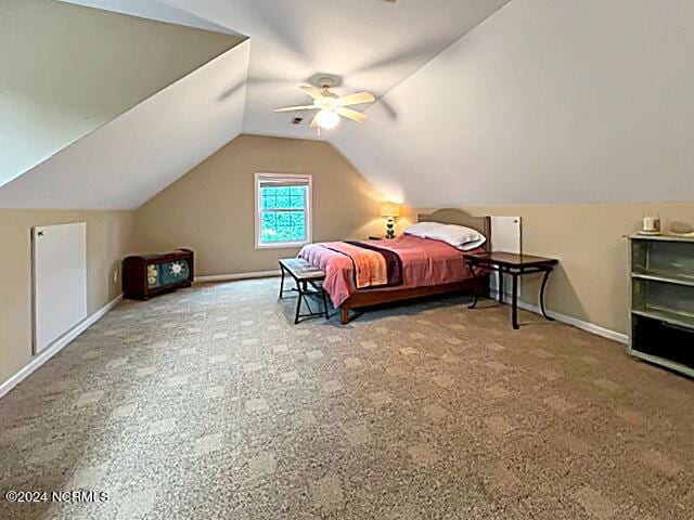 carpeted bedroom with ceiling fan, baseboards, and vaulted ceiling