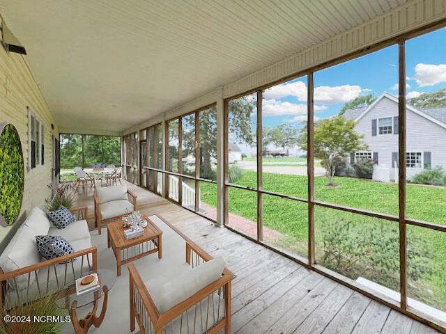 sunroom / solarium with vaulted ceiling