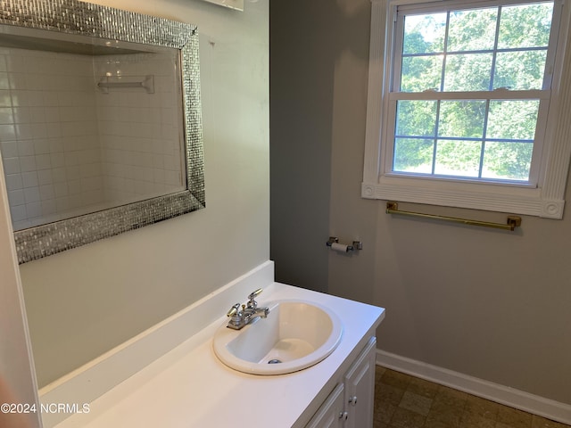 bathroom with vanity and baseboards